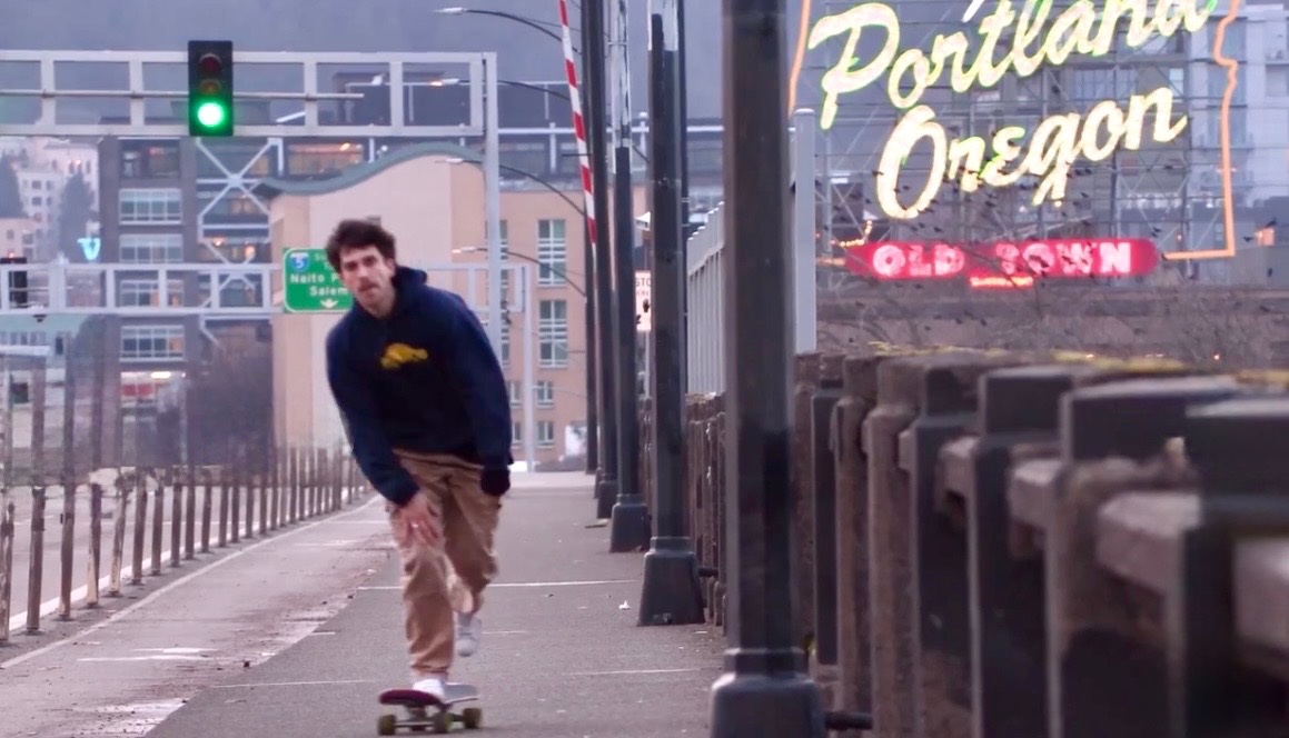 Skater cruising through Portland Old Town